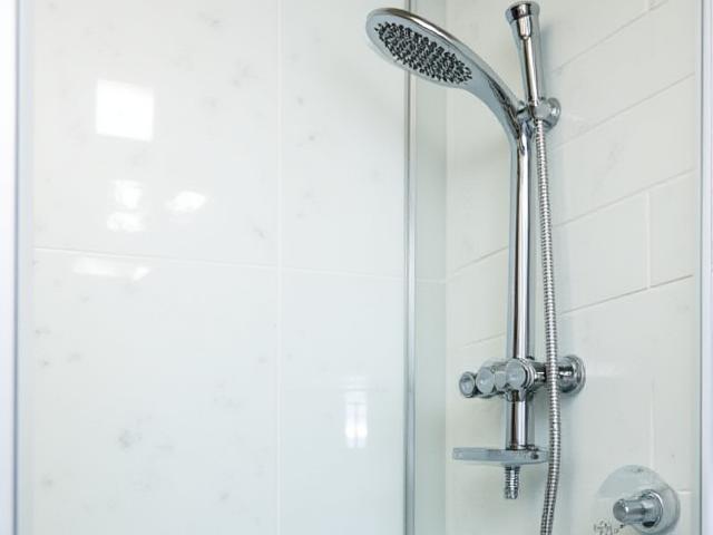 Modern shower fixture replacement, sleek design.